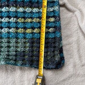 Handcrafted by me crocheted blanket. This also has a shell pattern.